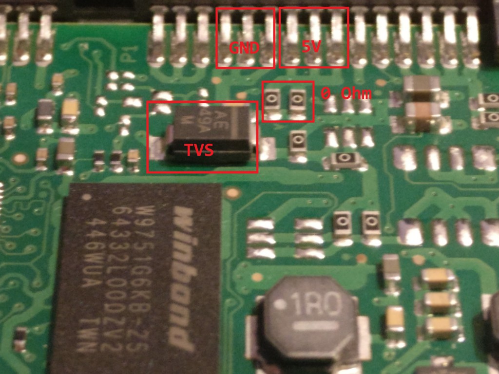 Zoom in of PCB close to the SATA connector. The 5V and GND inputs are highlighted as well as the presumed 5V TVS and microfuses (0 Ohm resistors).